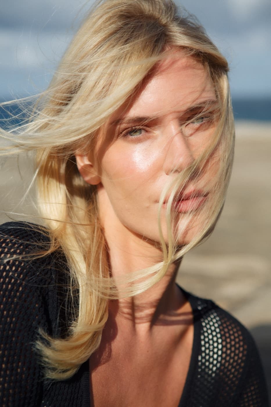 Blonde model photographed in the coastal breeze
